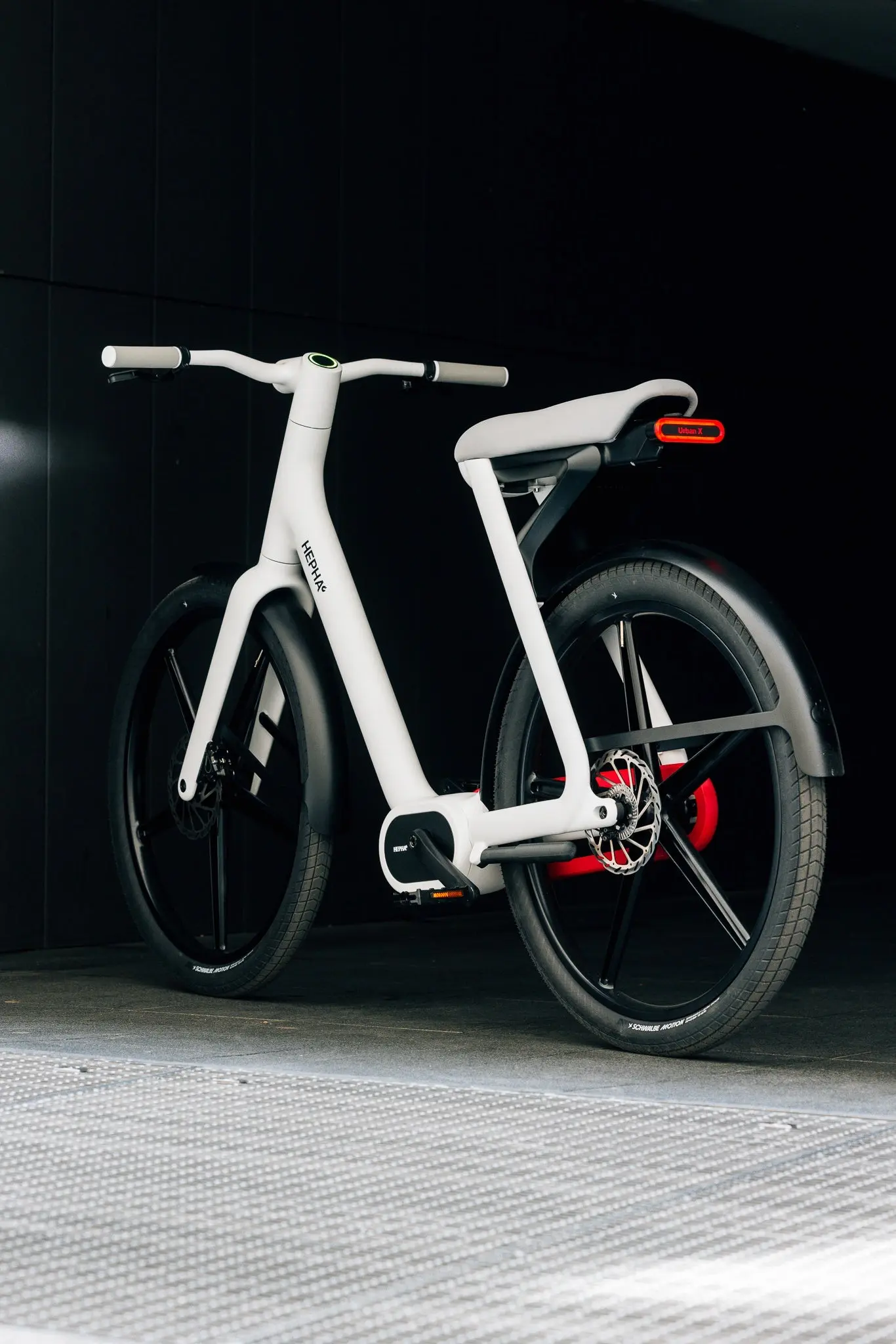 The Hepha Urban X from a front three-quarter view, with its clean white frame and solid wheels