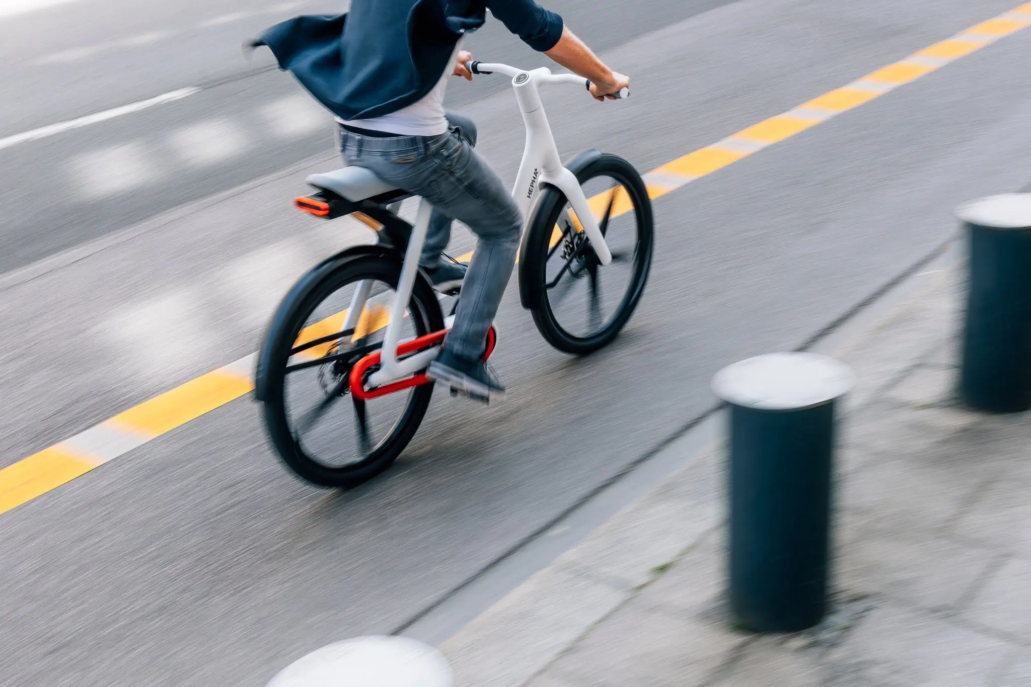 A cyclist riding the Hepha Urban X along a cycle path