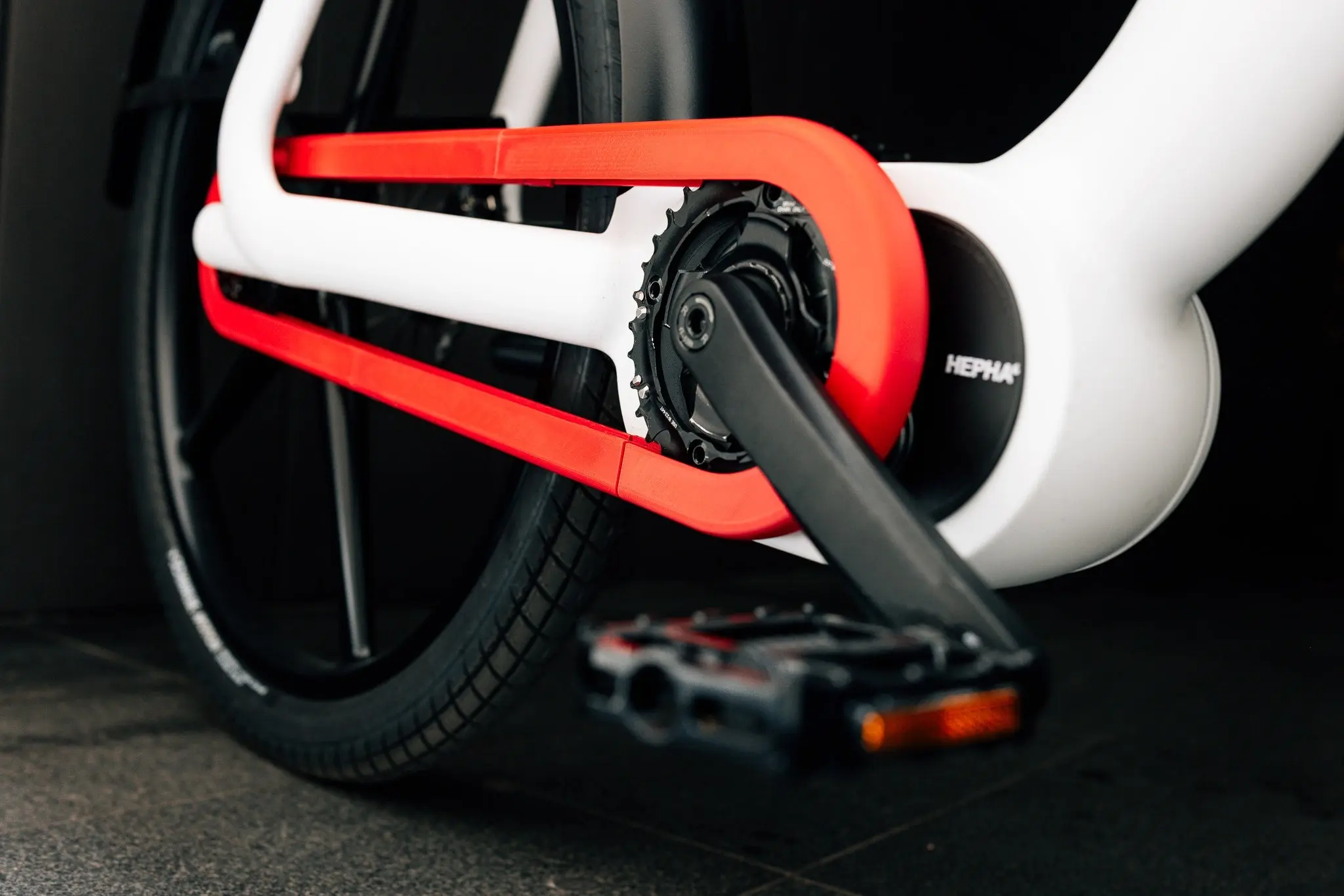 Close-up of the red belt drive and the eCVT mid-drive motor of the Hepha Urban X