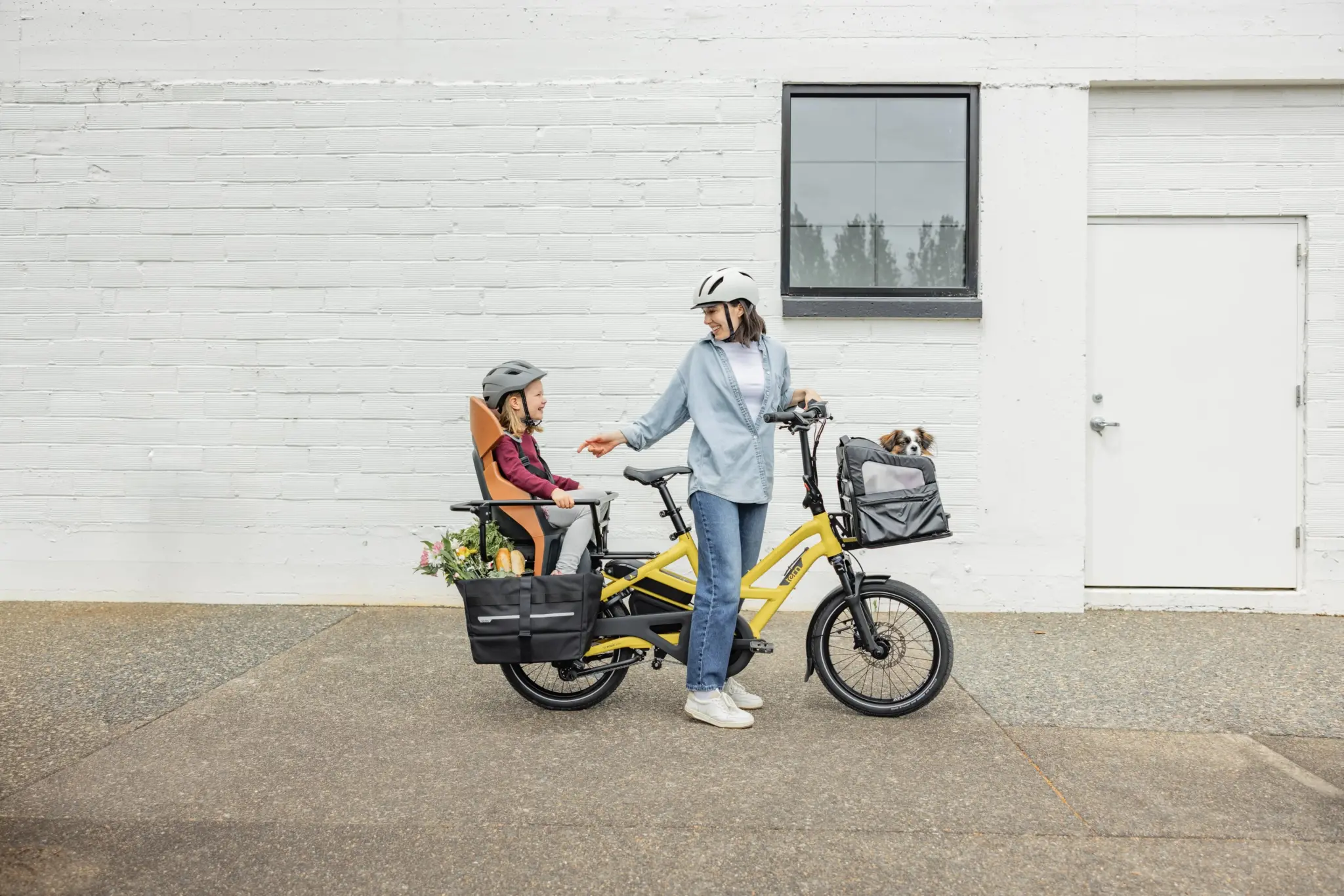 A parent carries a child on the rear of the new-generation Tern HSD