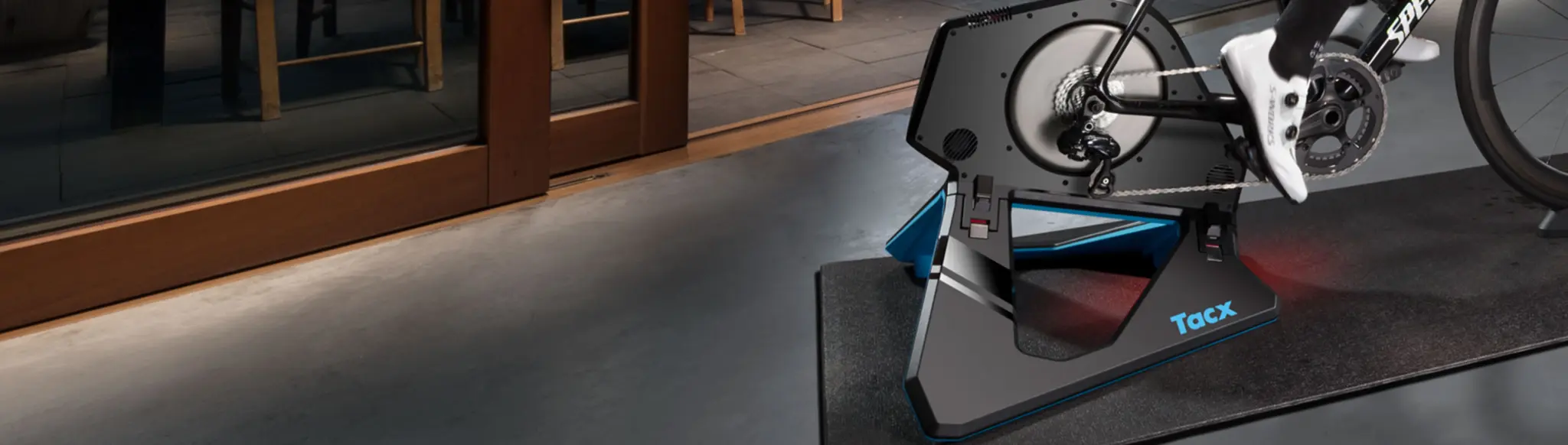 Tacx NEO 2T indoor trainer in use, seen from the drivetrain side