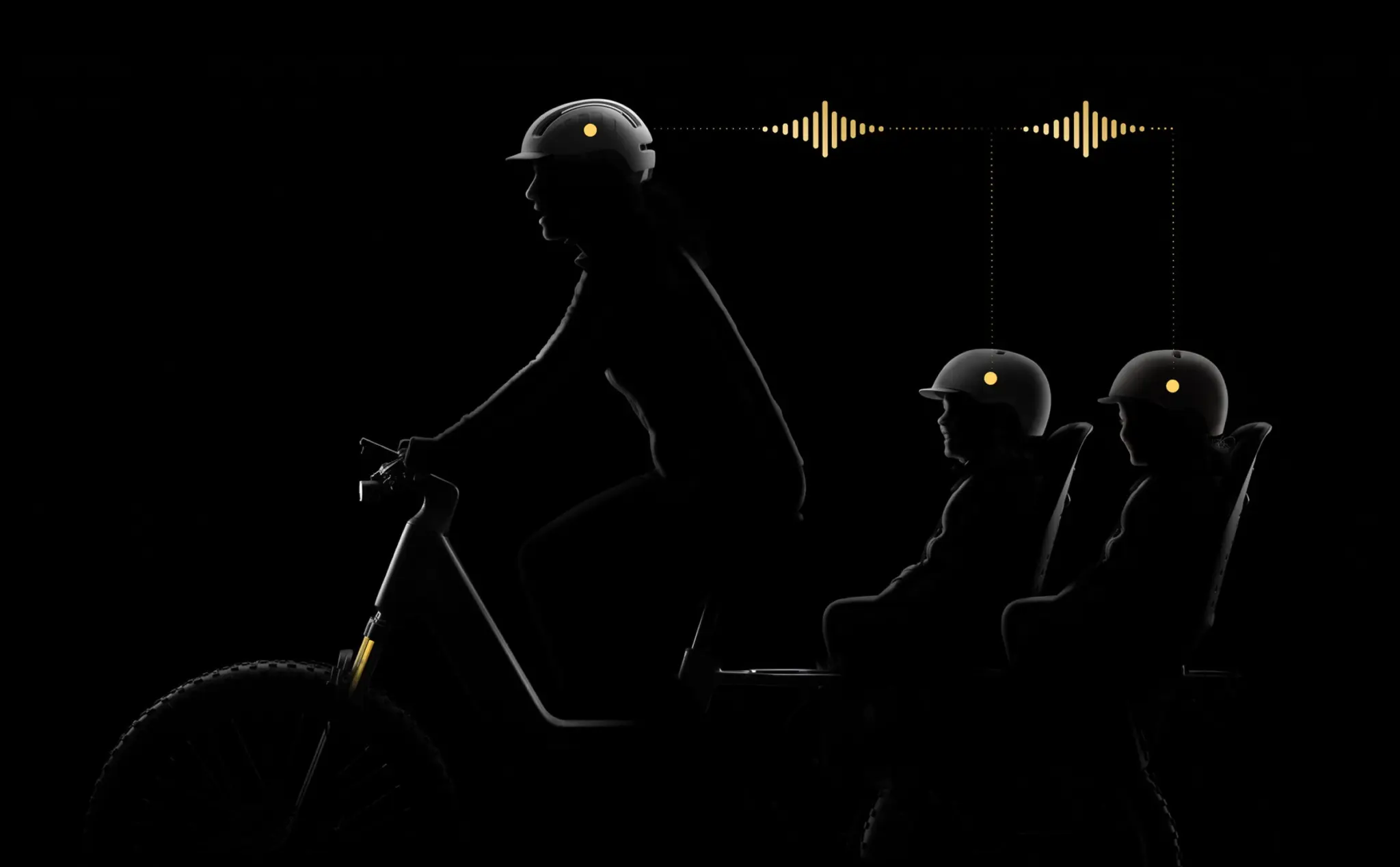 Silhouette of a rider and two helmeted children at the rear of the Lemmo 3 APV, linked by sound waves