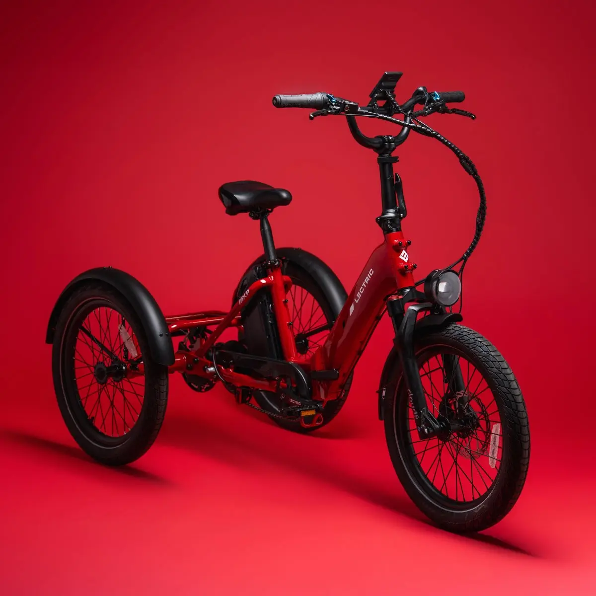 The red Lectric XP Trike 2 electric trike, in the studio