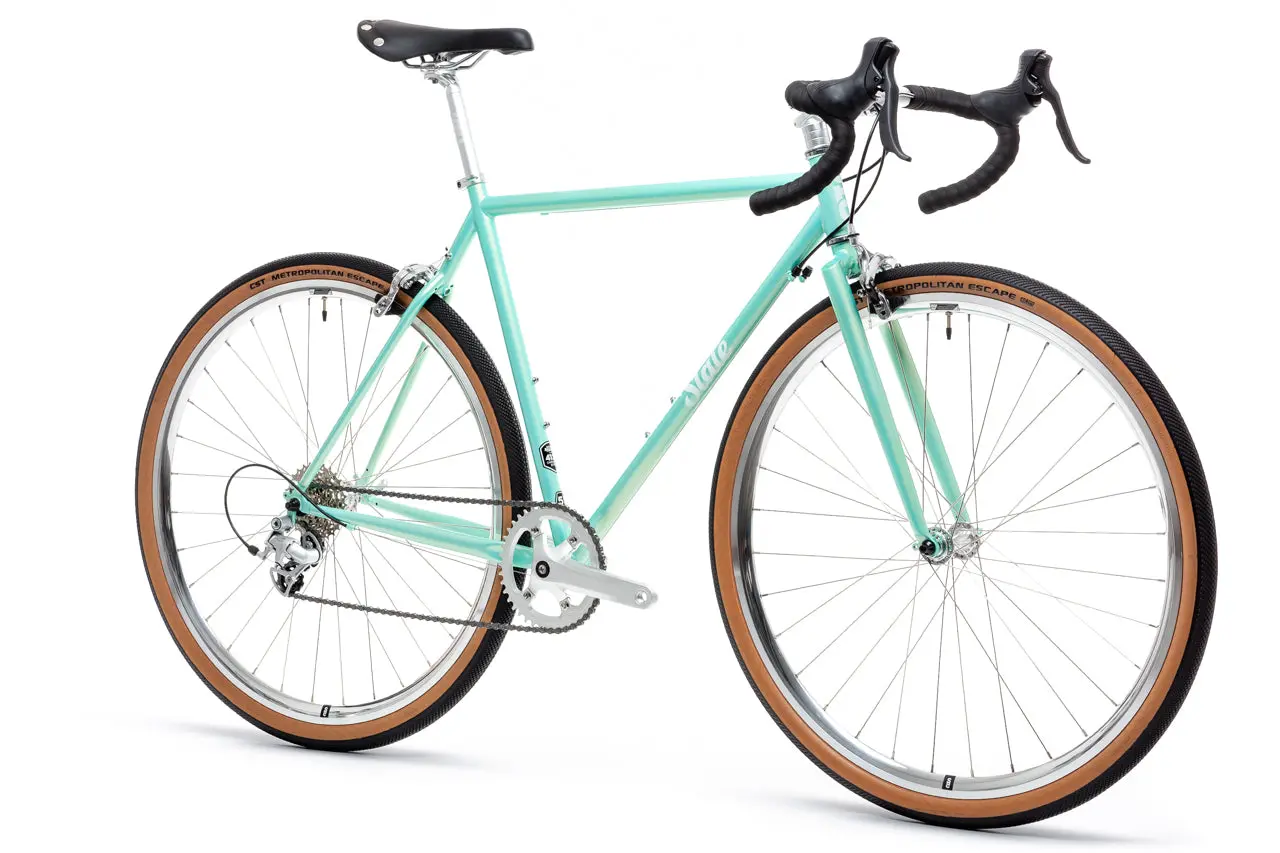 Sea-green State Bicycle 4130 Road v2 seen from the front three-quarter, with shifters integrated into the bar and rim brakes