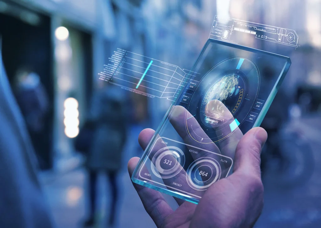 Hand holding a transparent smartphone showing a holographic interface in the street, VividQ press image