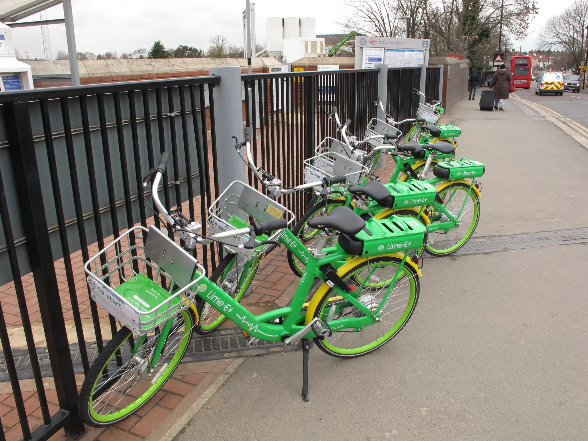 Lime rental e-bikes outside a London railway station