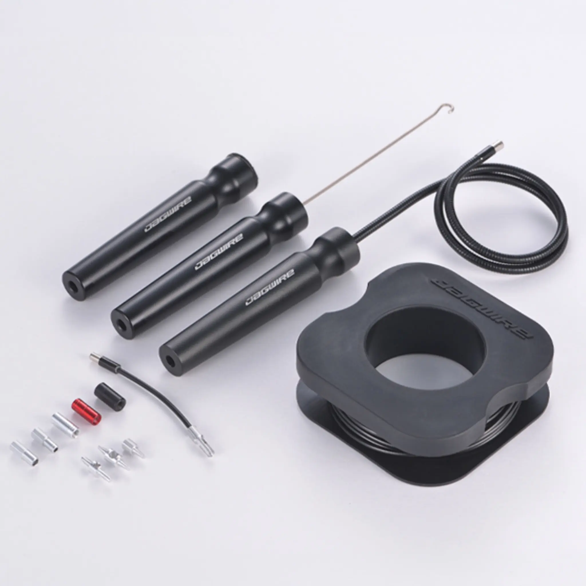 Jagwire Elite Internal Routing Tool kit: three black handles, retrieval hook, adapters and a spool of magnetic wire