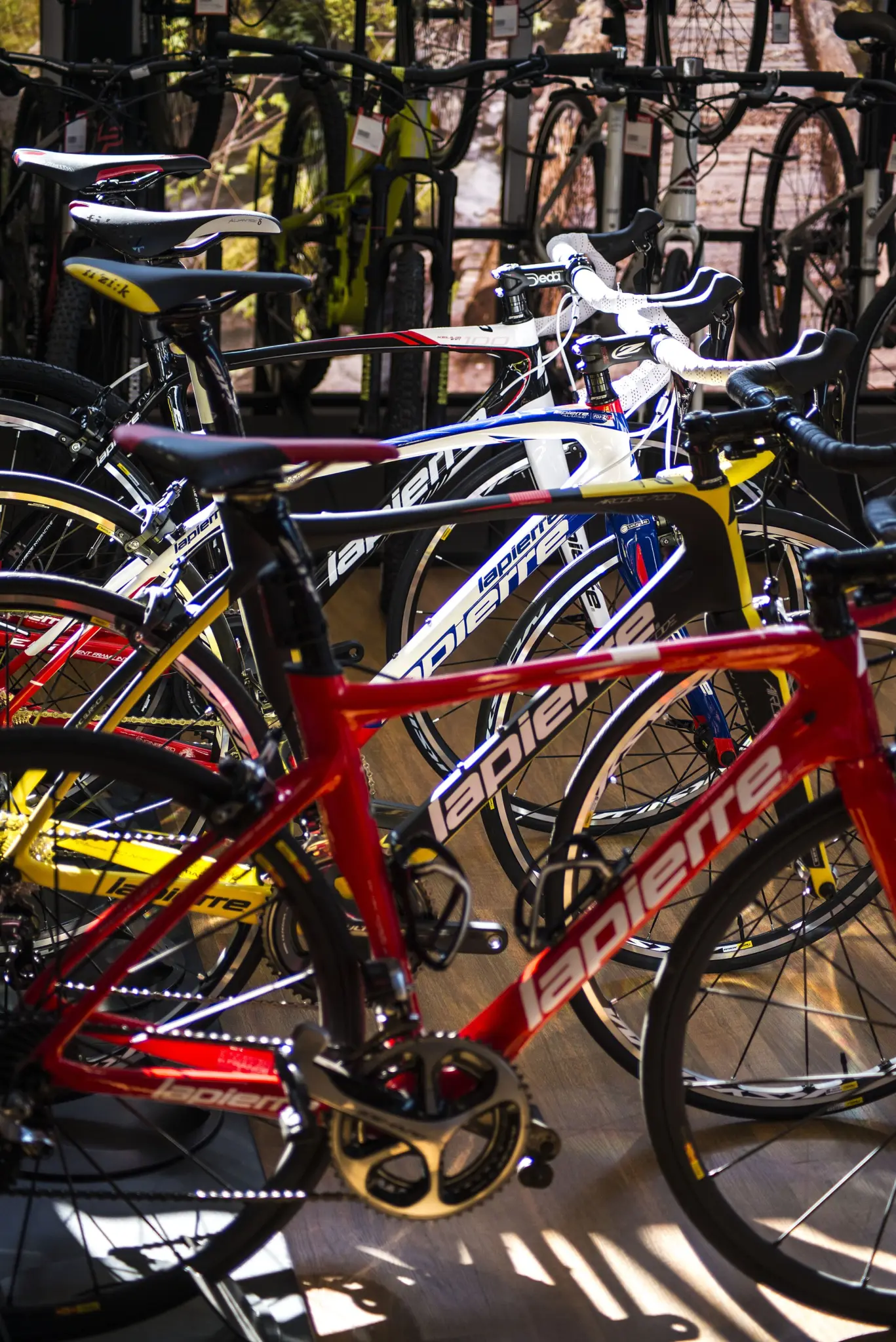 Several Cycles Lapierre road bikes on display in a bike shop