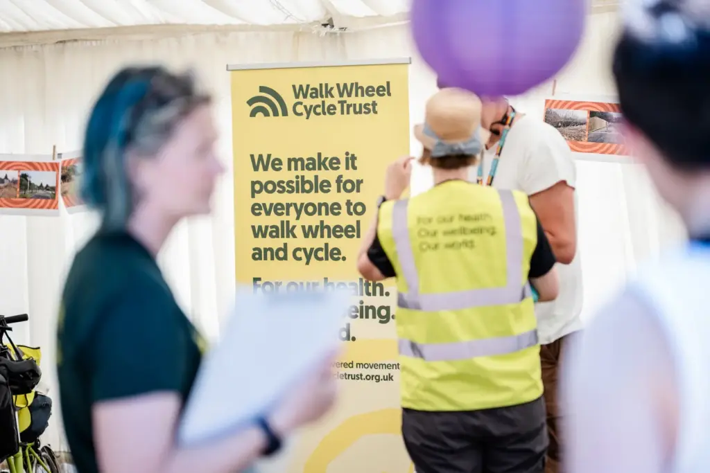 Walk Wheel Cycle Trust stand, manager of the National Cycle Network, with a person in a high-visibility vest