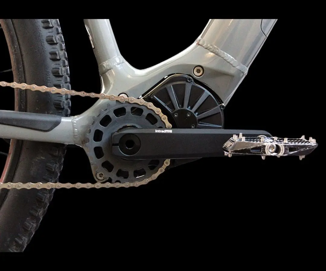 Intradrive GD8 motor unit with integrated gearbox mounted at the bottom bracket of a mountain bike, with crank and chainring