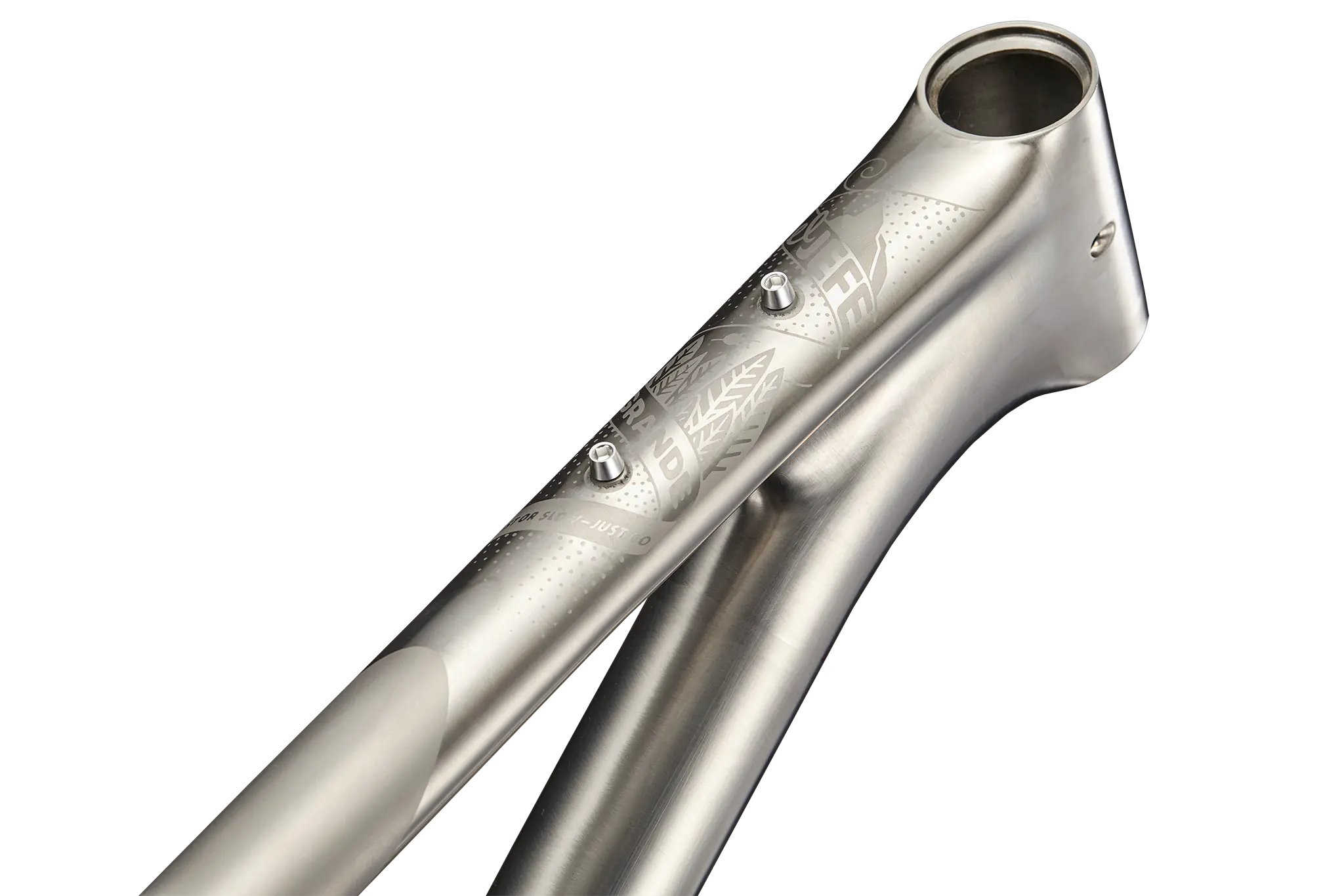 Close-up of the 3D-printed titanium head tube of the Revel El Jefe Grande, engraved with the brand's logo