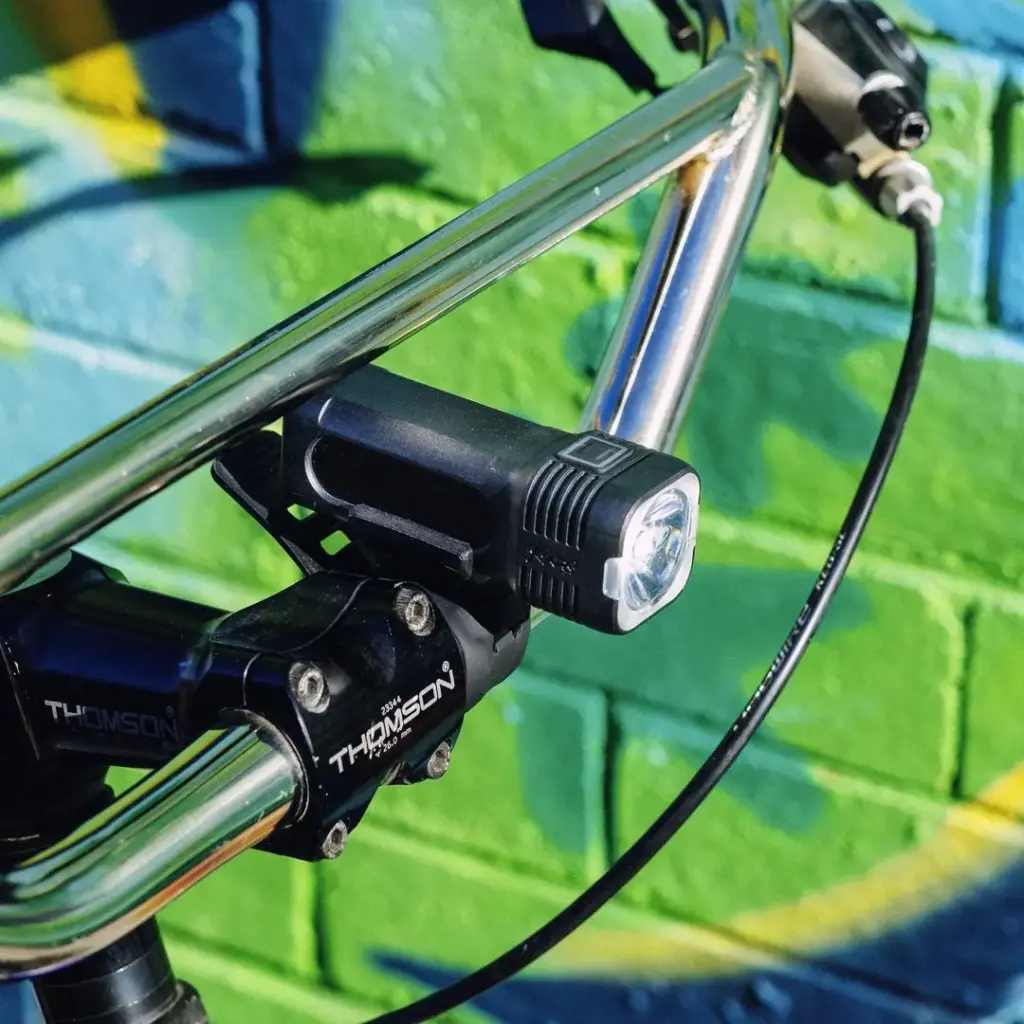 Knog Blinder 400 bike light mounted on a handlebar