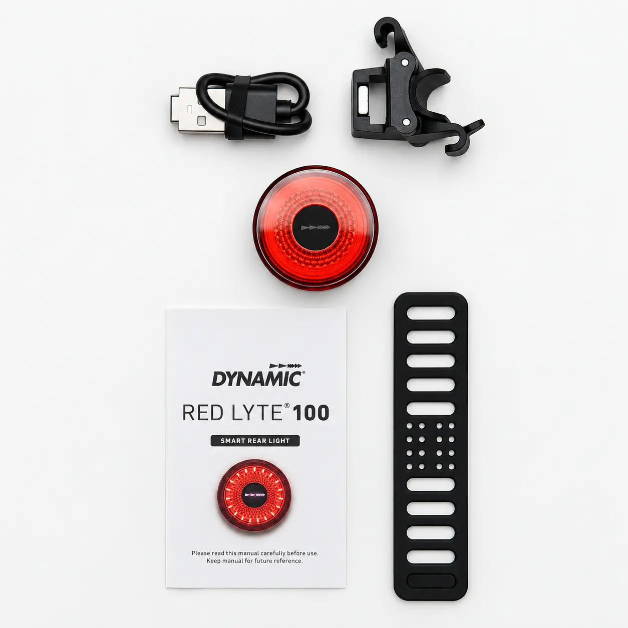 Feu arrière Dynamic Red Lyte 100 posé avec son câble USB, son support aimanté et sa sangle en silicone