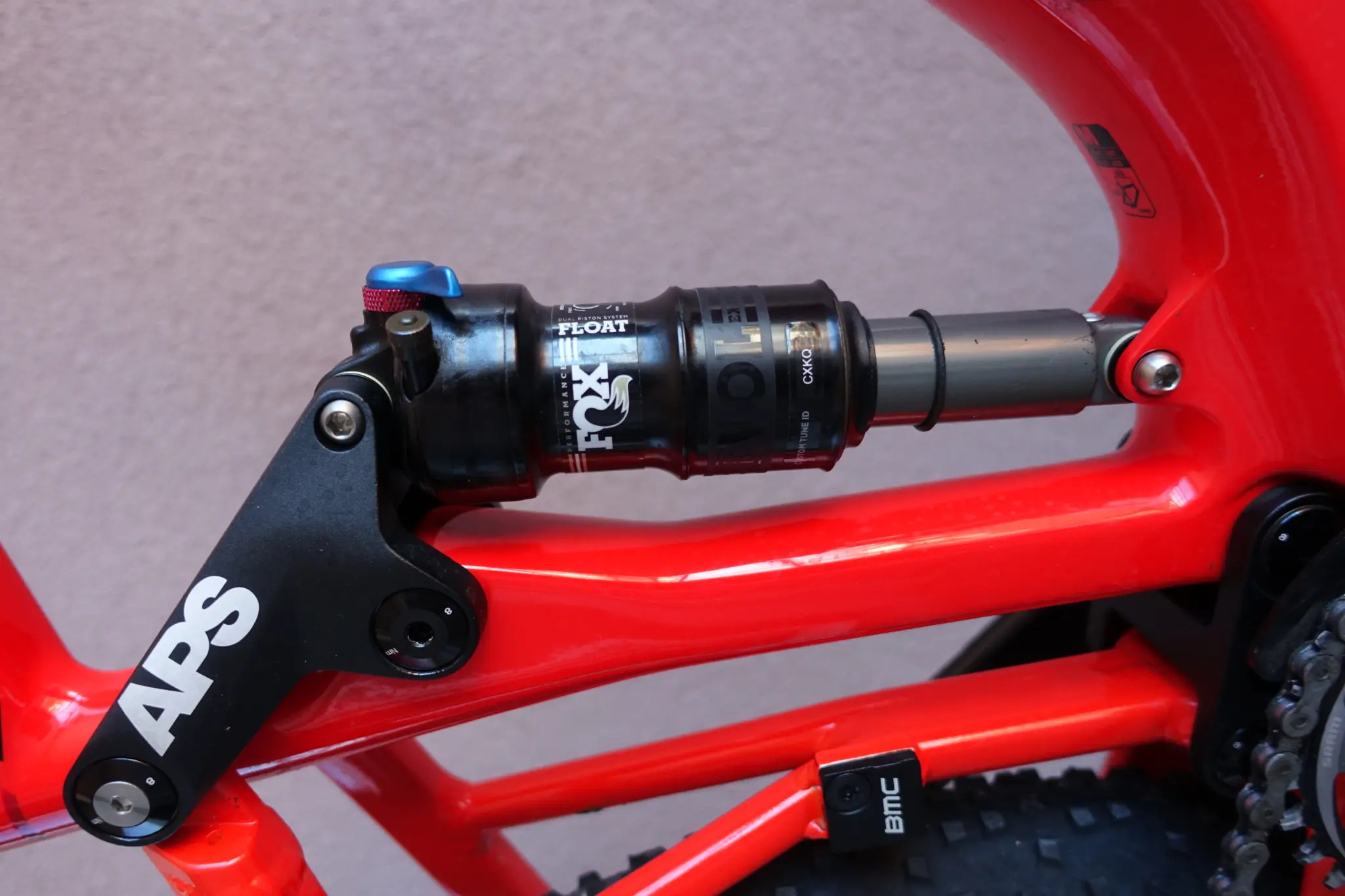 Black Fox Float shock from Fox Factory, mounted under the APS linkage of a red BMC mountain bike